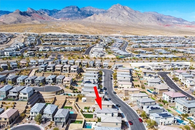 birds eye view of property with a mountain view