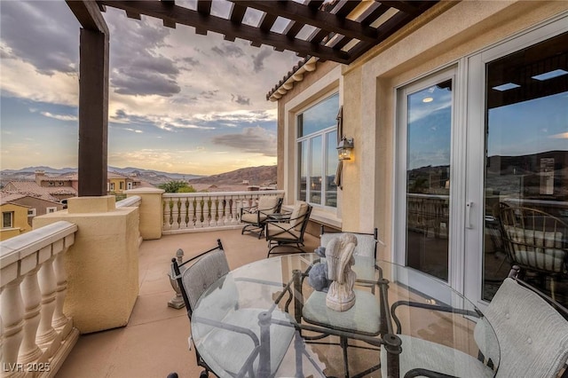 balcony at dusk with a mountain view