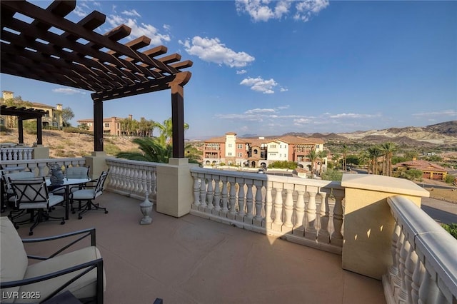 view of patio with a mountain view and a pergola