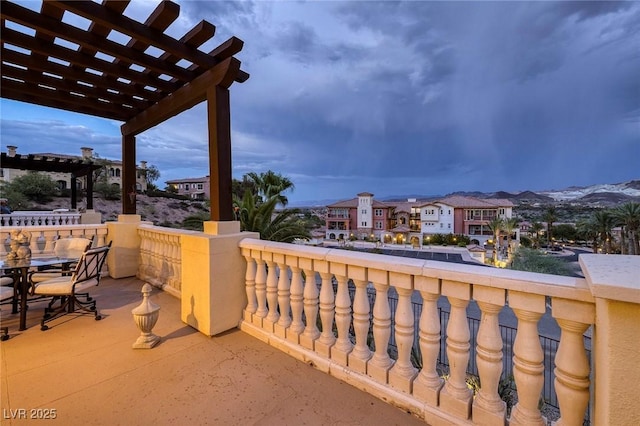 balcony featuring a pergola