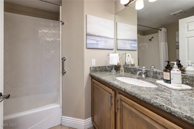 bathroom featuring vanity and shower / bath combo