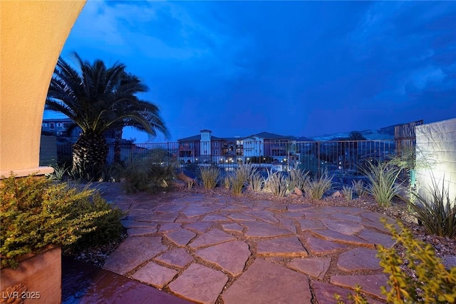 view of patio terrace at dusk