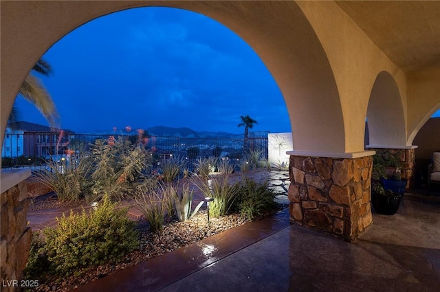 view of patio terrace at dusk