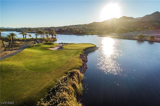 birds eye view of property featuring a water and mountain view