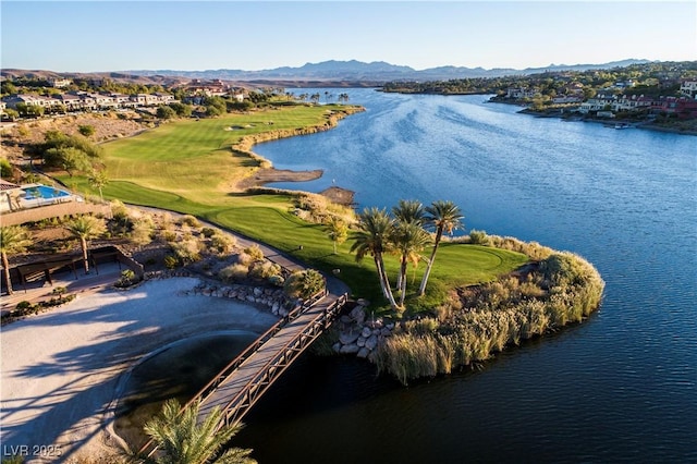 birds eye view of property with a water and mountain view