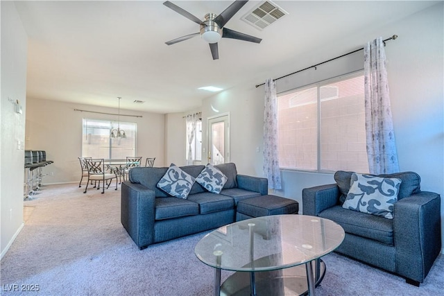 living room with light colored carpet and ceiling fan