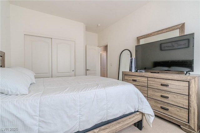 bedroom with carpet floors and a closet