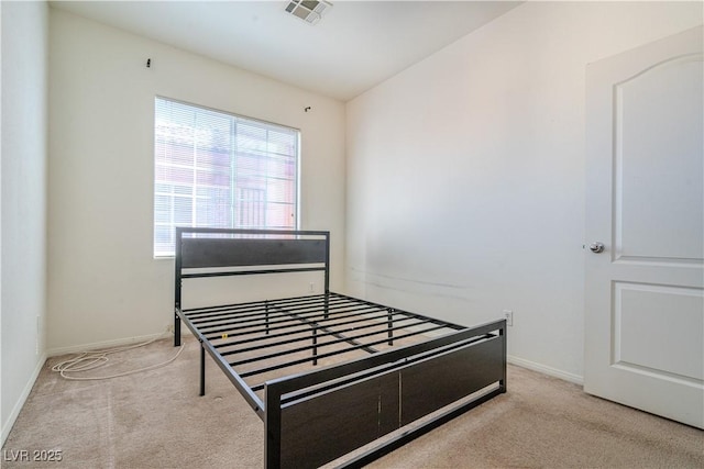 bedroom featuring light colored carpet