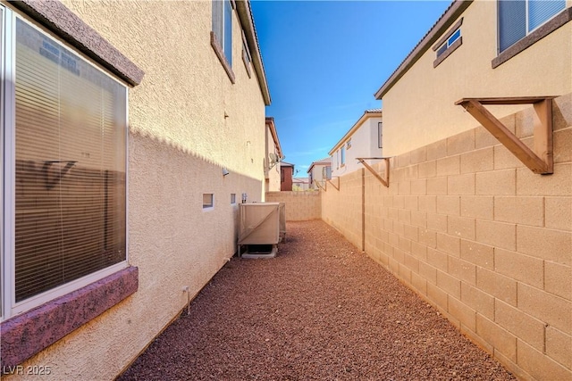 view of home's exterior with central AC unit