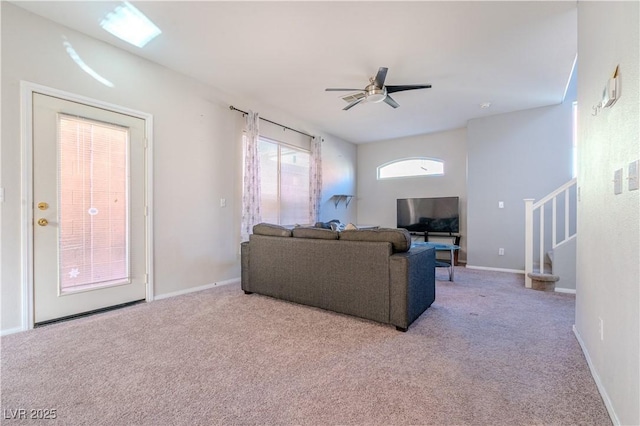 living room with light carpet and ceiling fan