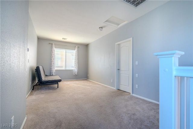 unfurnished room featuring light colored carpet