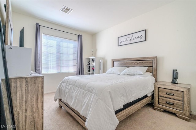 bedroom with light carpet