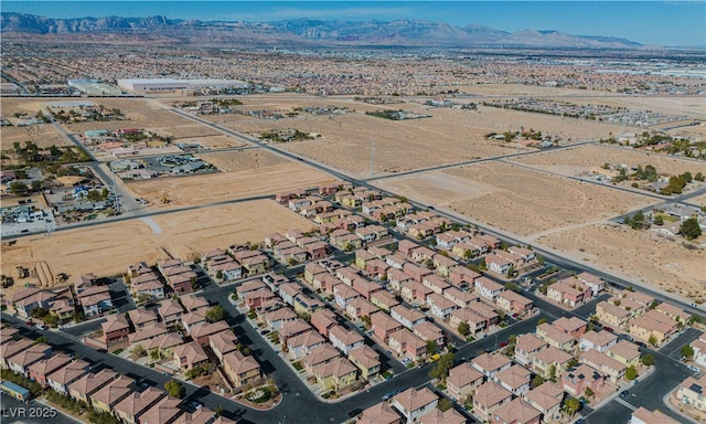 birds eye view of property featuring a mountain view