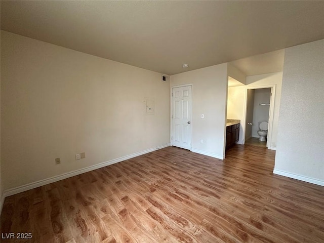 empty room with wood-type flooring