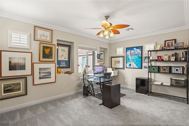 carpeted home office with crown molding and ceiling fan