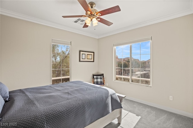 bedroom with crown molding, light colored carpet, and ceiling fan