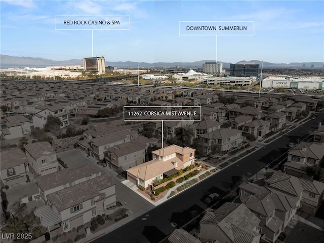 birds eye view of property with a mountain view