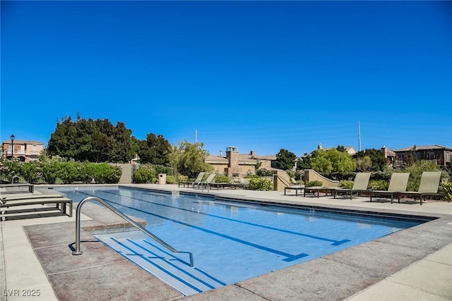 view of swimming pool with a patio area