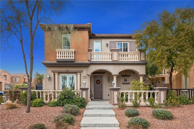 view of front of house with a balcony