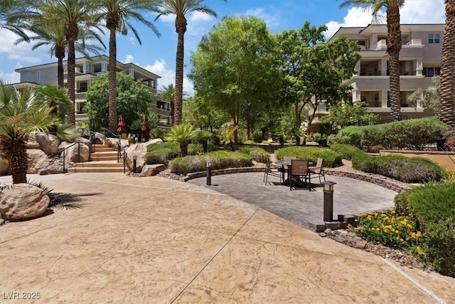 surrounding community featuring a patio area