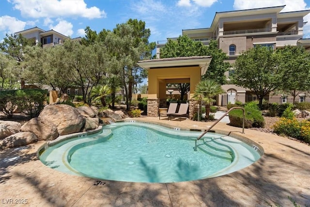 view of swimming pool featuring a patio area