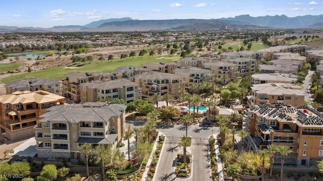 birds eye view of property featuring a mountain view