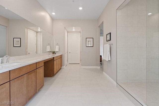 bathroom with vanity, a shower, and tile patterned floors