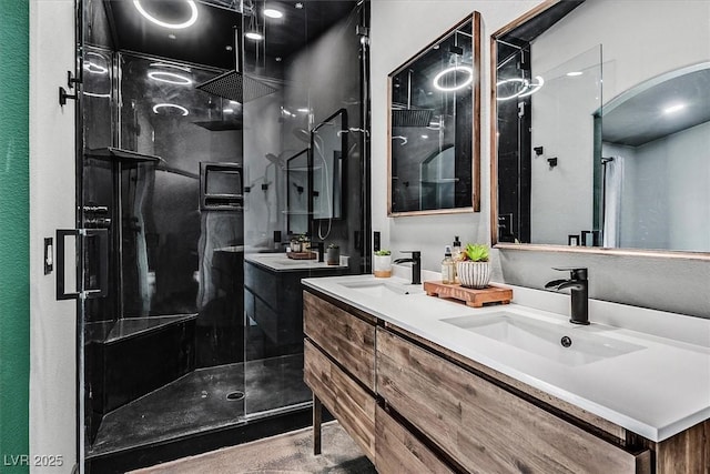 bathroom featuring vanity and an enclosed shower