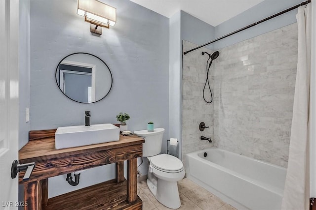 full bathroom featuring tile patterned floors, toilet, sink, and shower / bath combo