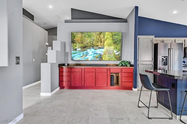 home theater featuring lofted ceiling