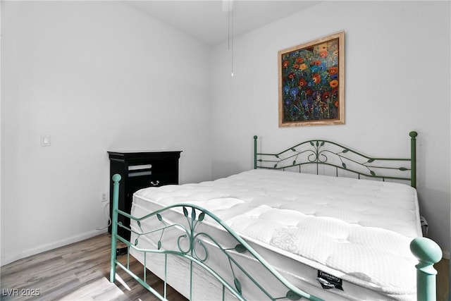 bedroom featuring hardwood / wood-style flooring