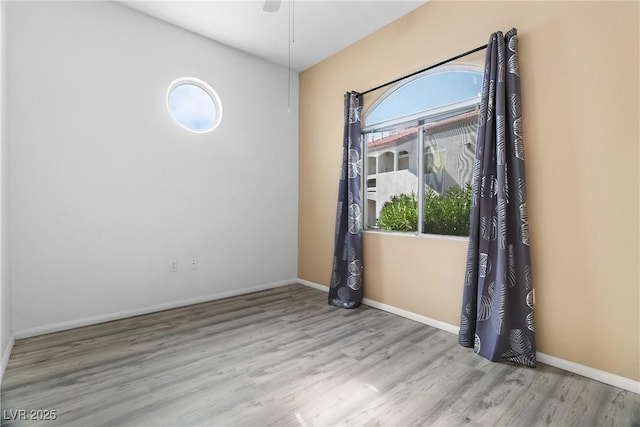 empty room featuring light hardwood / wood-style floors and ceiling fan