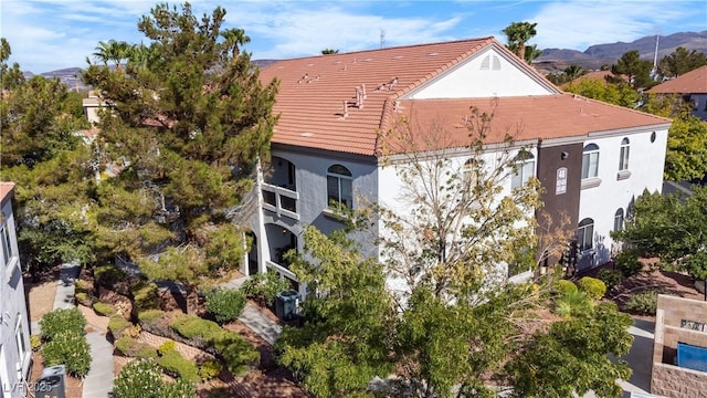 rear view of house featuring a mountain view