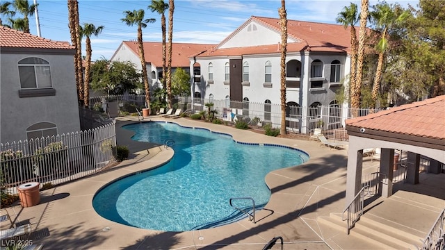 view of swimming pool with a patio area