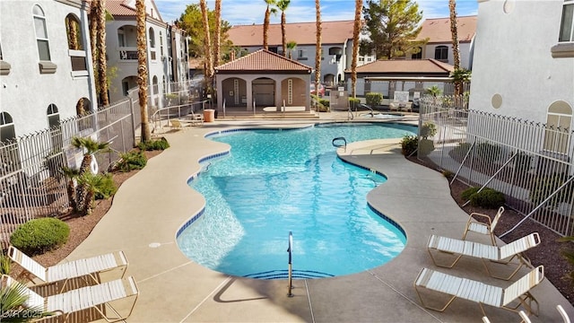 view of swimming pool with a gazebo and a patio