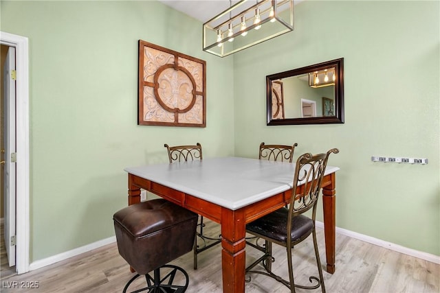 dining area featuring light wood-type flooring