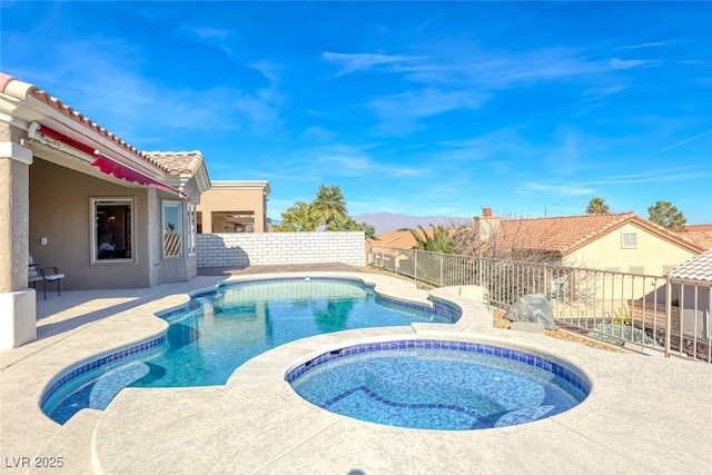 view of pool with a patio, a fenced backyard, a mountain view, an in ground hot tub, and a fenced in pool