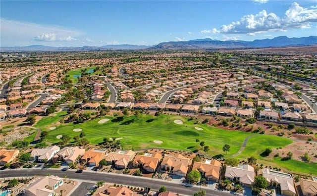 birds eye view of property featuring golf course view, a residential view, and a mountain view