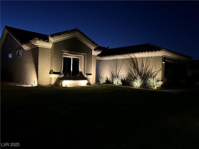 2540 Youngdale Dr, Las Vegas, NV 89134 - view of front of property featuring stucco siding, an attached garage, and a tiled roof