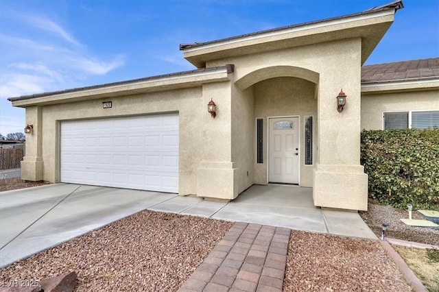 entrance to property featuring a garage