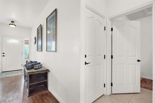 hall with light hardwood / wood-style floors