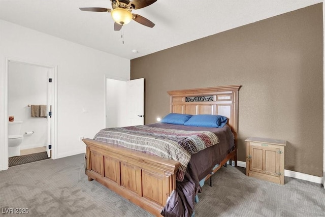 bedroom featuring ensuite bathroom, ceiling fan, and carpet