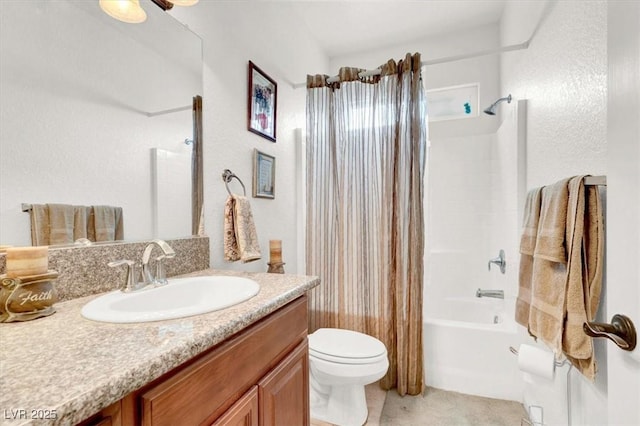 full bathroom featuring vanity, shower / tub combo with curtain, and toilet