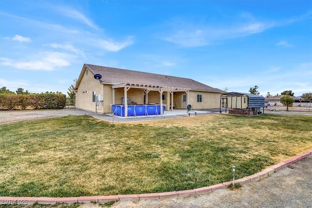 rear view of property featuring a yard