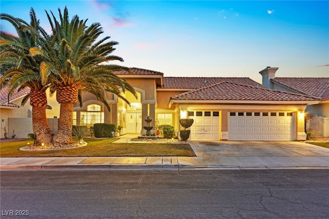 mediterranean / spanish-style house featuring a garage