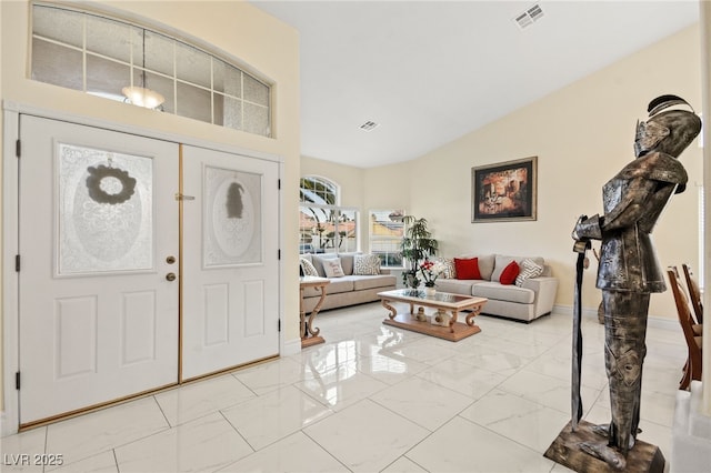 foyer entrance with vaulted ceiling