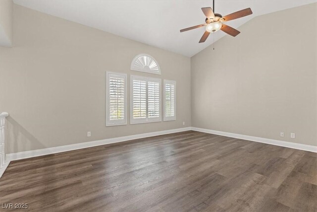 empty room with dark wood-type flooring, ceiling fan, and high vaulted ceiling