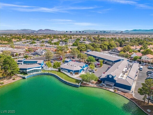 aerial view featuring a water and mountain view