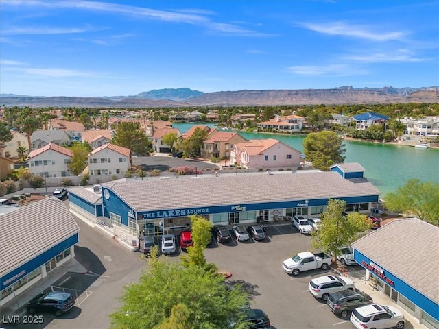 bird's eye view featuring a residential view and a water and mountain view