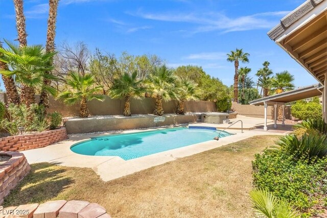 view of pool with a hot tub and a patio